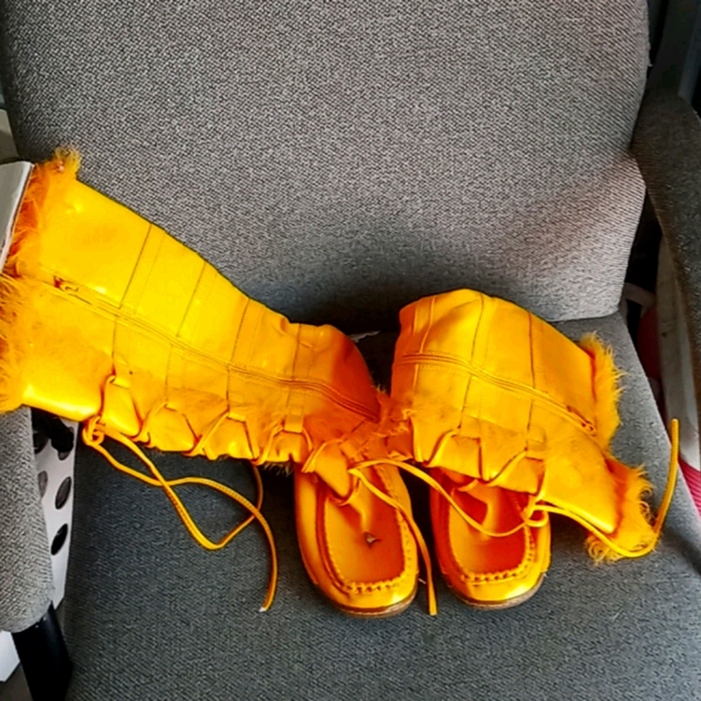 Current ladies yellow boots with feathers